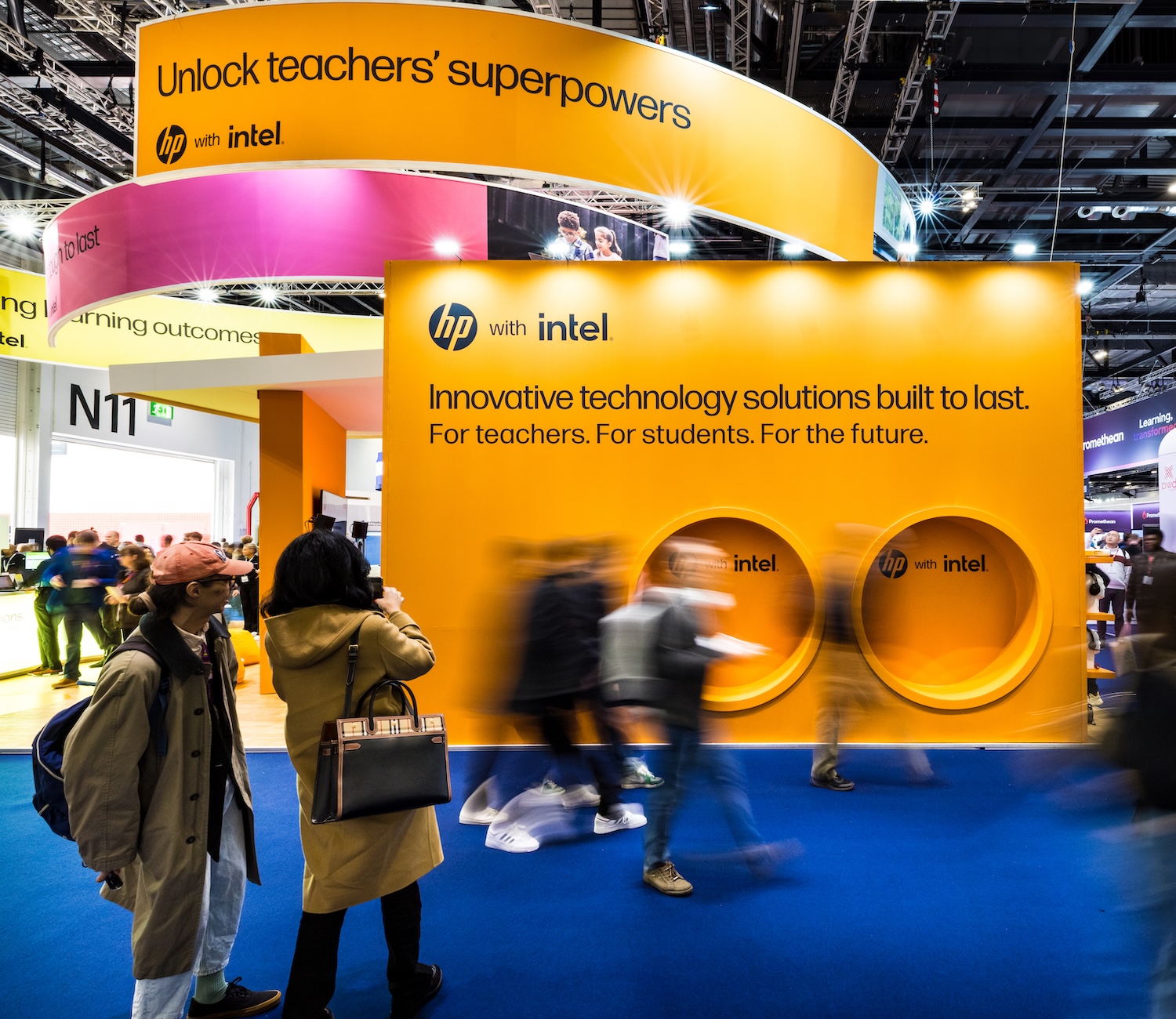 Vibrant exhibition stand with attendees.